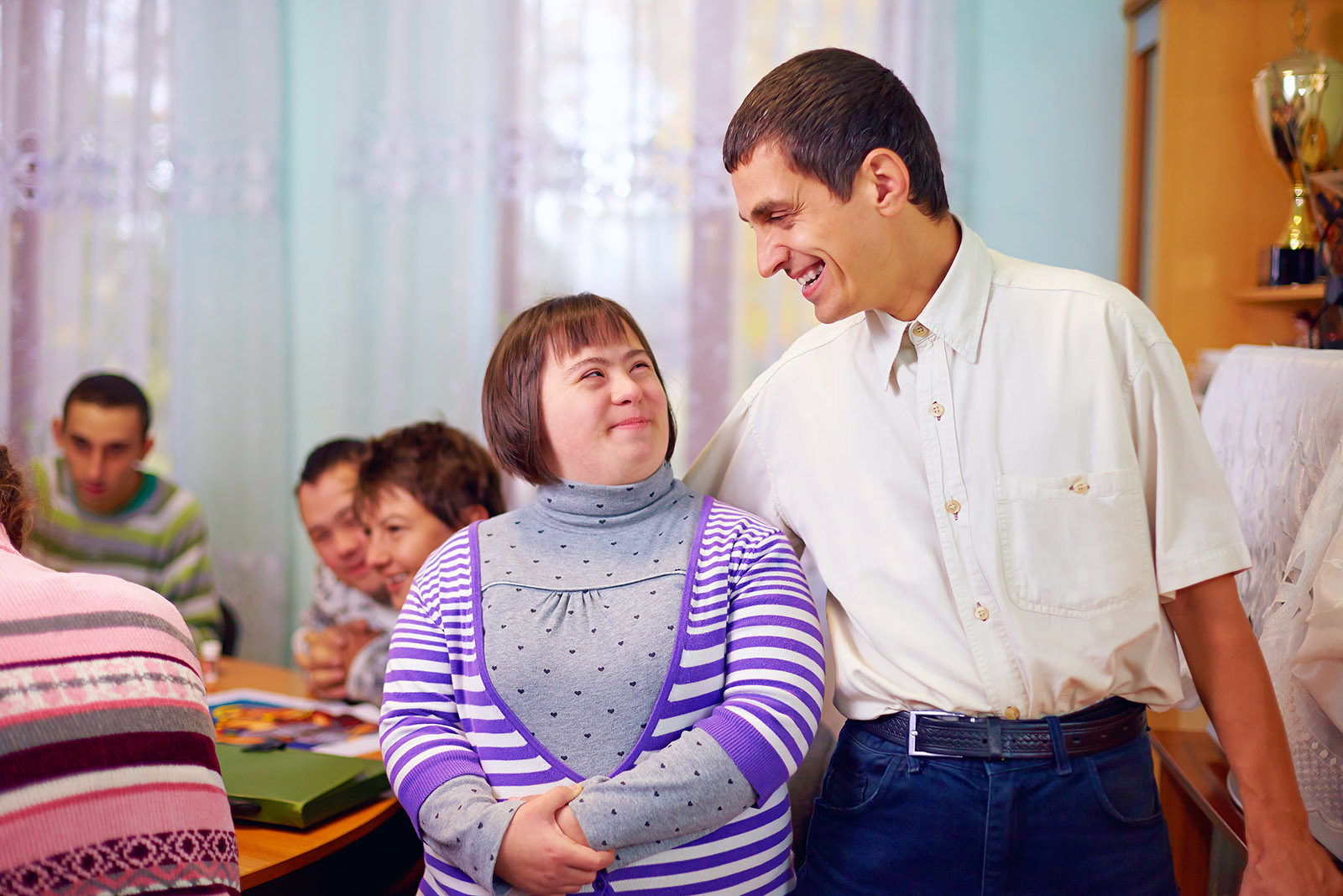 happy people with disability in rehabilitation center
